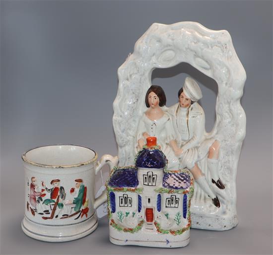 A Staffordshire figure group, a flatback castle and a frog mug and three musical mugs